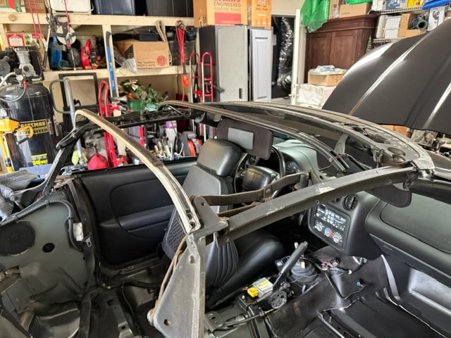 Convertible soft top frame and mechanism exposed